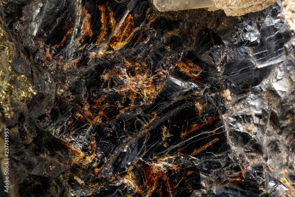 Macro of a mineral stone Sphalerite with fluorite and pyrite on a black background close up