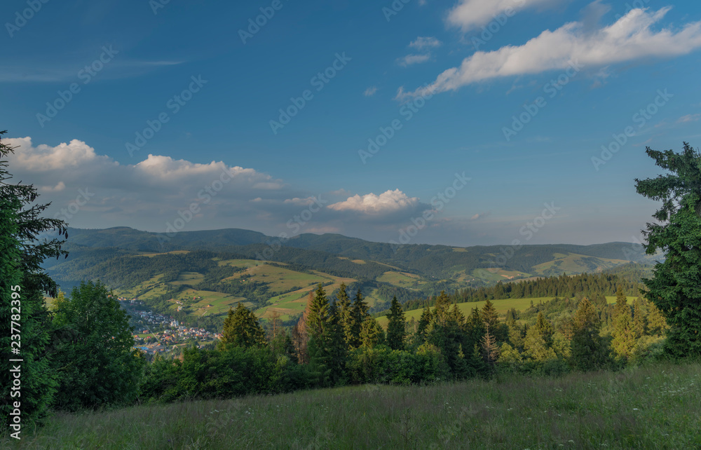 Fototapeta premium Evening in national park Pieniny with sunny shine over green meadows