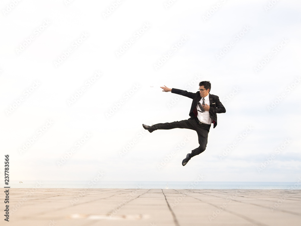man wearing suit jumping outdoor man wearing suit jumping outdoor