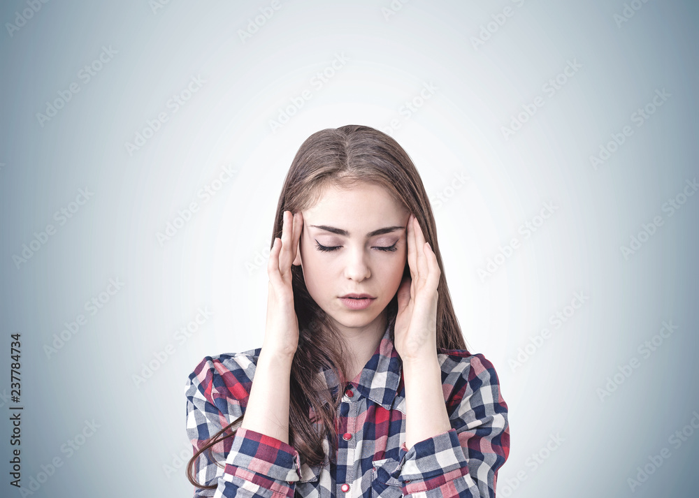 Young woman with headache, gray Young woman with headache, gray