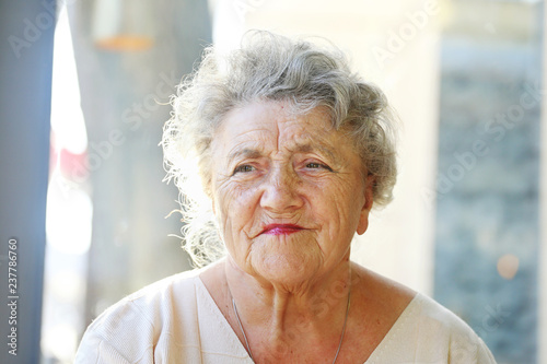 Elderly woman tired and sad looking face