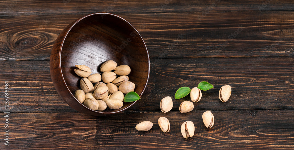Wooden bowl with mixed nuts Wooden bowl with mixed nuts