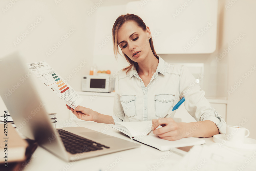 Woman Is Making Notes. Work From Home Concept. Woman Is Making Notes. Work From Home Concept.