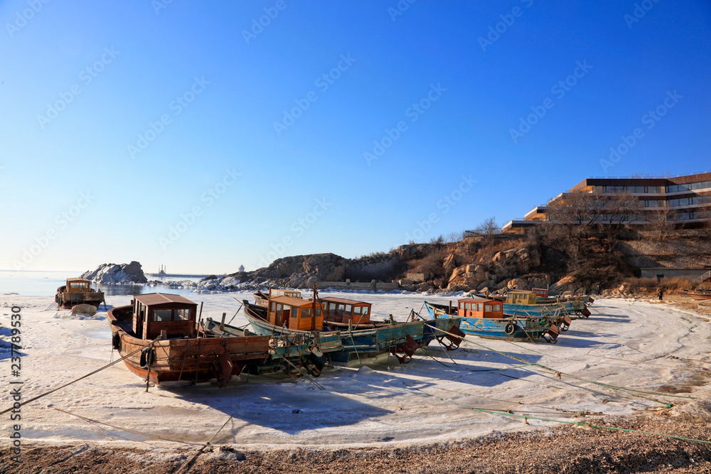 Fototapeta premium Wooden and reef in ice and snow