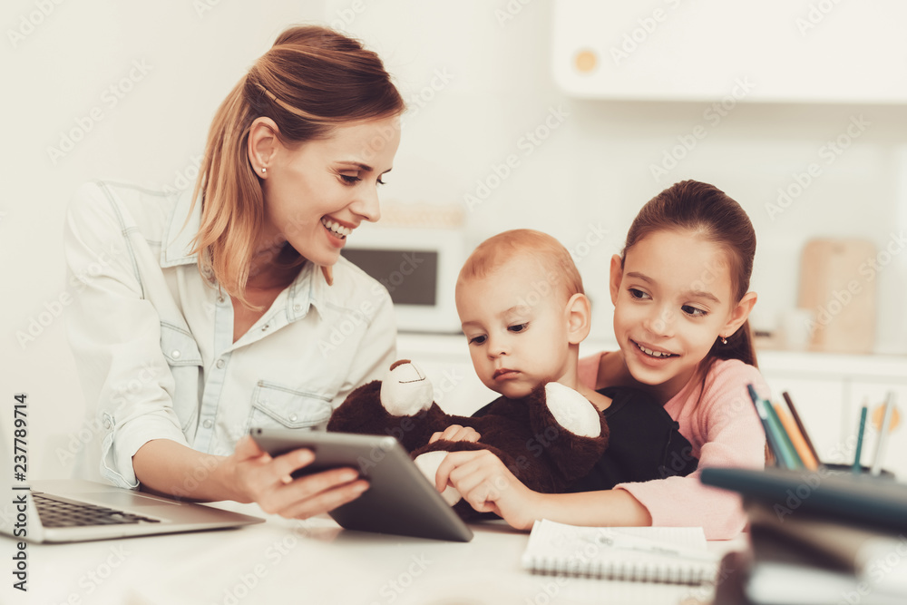 Mom And Daughter Are Playing With Little Baby. Mom And Daughter Are Playing With Little Baby.