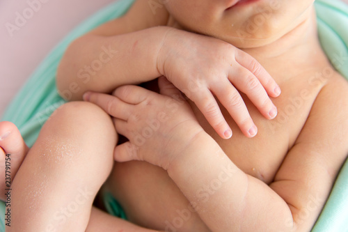 newborn child. little girl. newborn on a pink blanket. first photo shoot