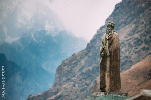 Stepantsminda  Georgia. Statue Of Alexander Kazbegi And Mountain