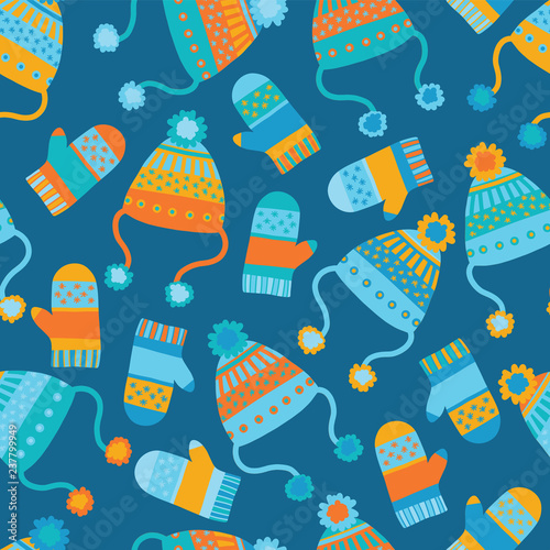 Seamless vector background with hats and mittens. Pattern tile with knitted winter clothes in orange and blue. Winter wear design. Flat Scandinavian style. Use for paper, banner, cards, poster, fabric