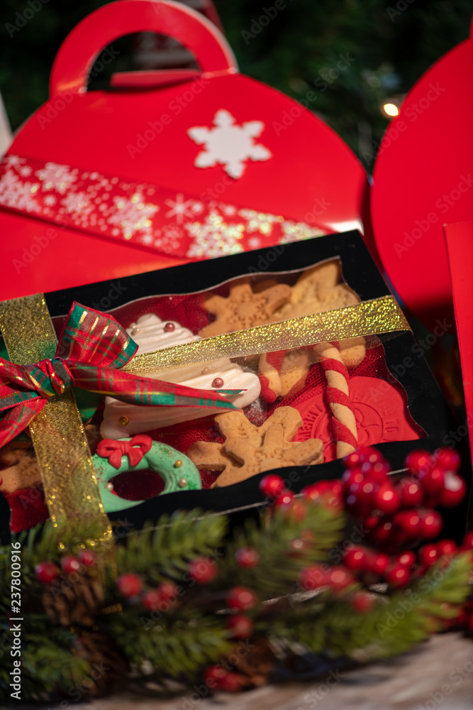 Christmas cookies gift boxes with christmas tree on wood table