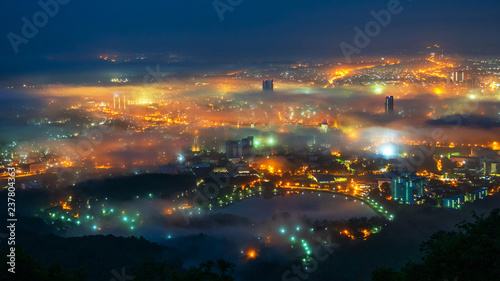 Beautiful fog over the city at night