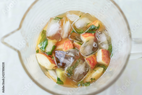 Jug of drink with fruits, ice and pimm's photo