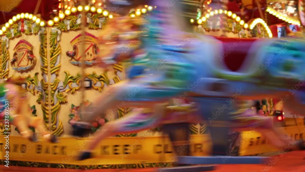 merry go round carousel horses funfair fairground ride, merry go round carousel horse funfair fairground stock footage video - horse carousels popular in victorian times
