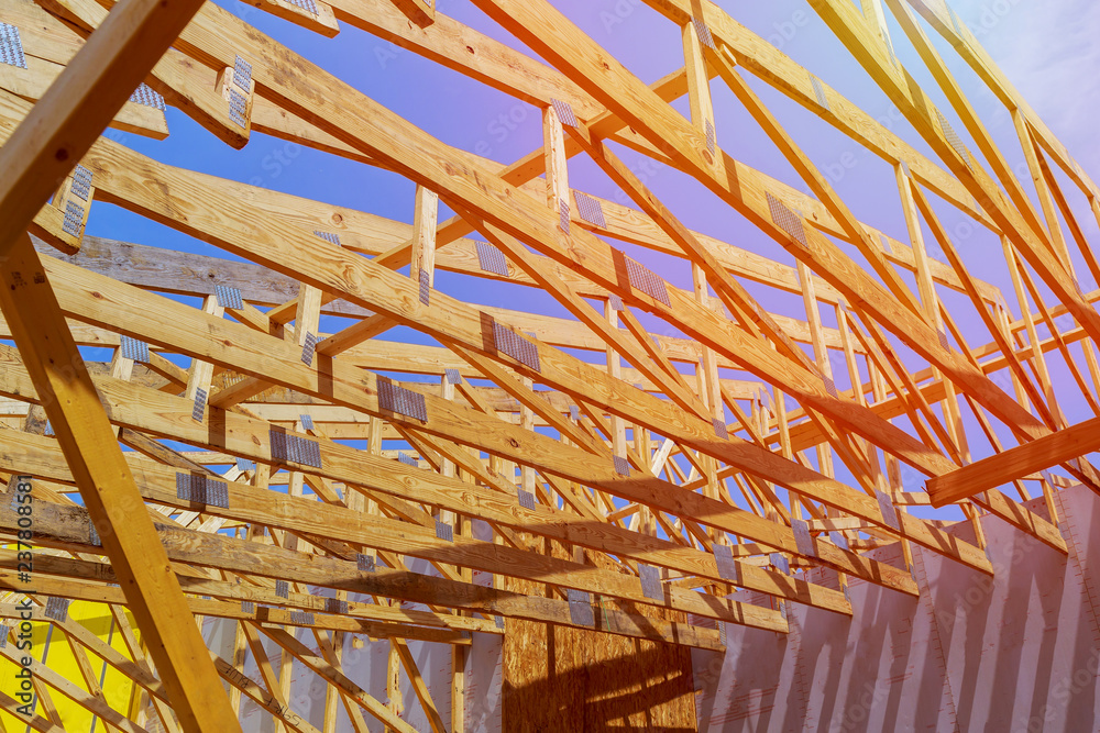 A stick built house under construction New build with wooden and beam framework. A stick built house under construction New build with wooden and beam framework.