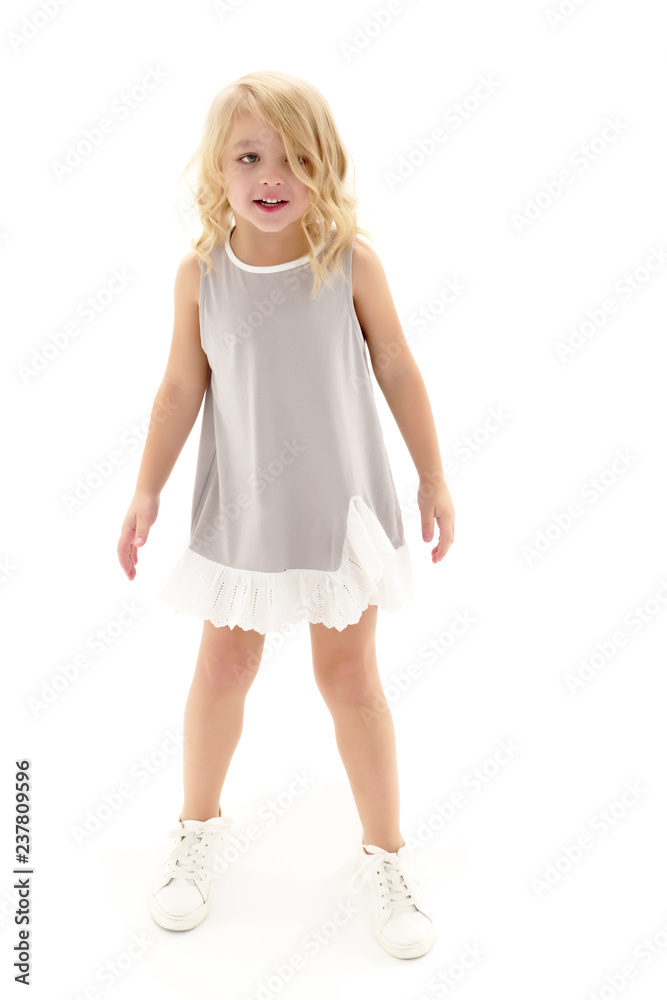 Naklejka premium The little girl is full-length.