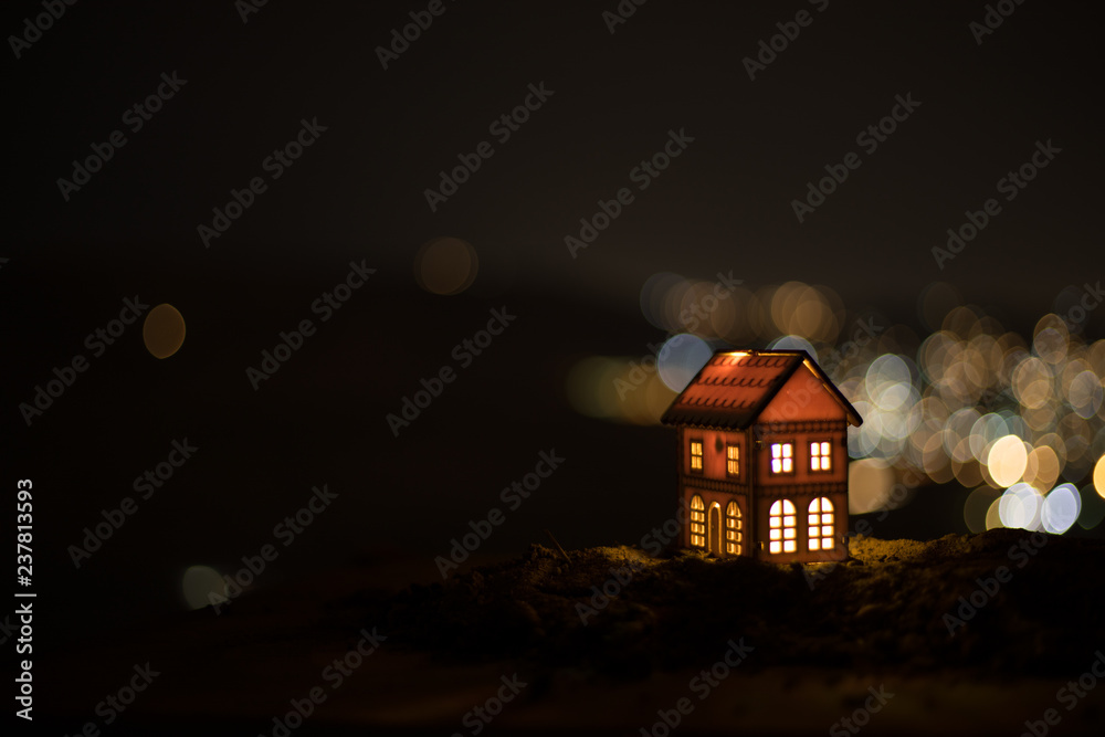 Little decorative house, beautiful festive still life, cute small house at night, Night city real bokeh background, happy winter holidays Little decorative house, beautiful festive still life, cute small house at night, Night city real bokeh background, happy winter holidays