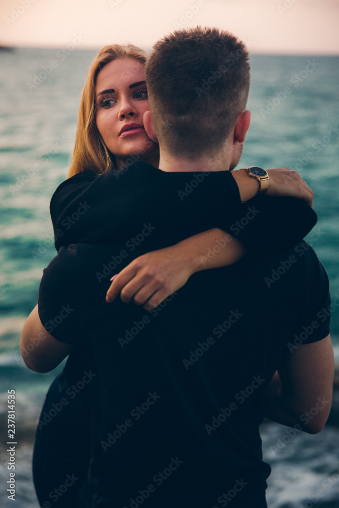 Couple in love on the background of the sea