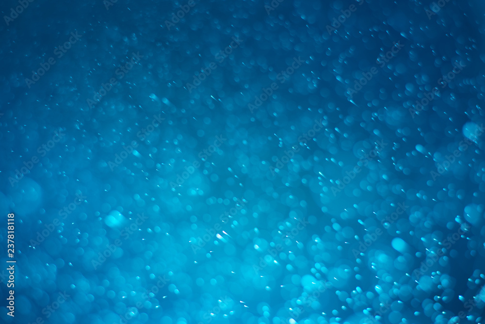 Abstract blue bokeh background.