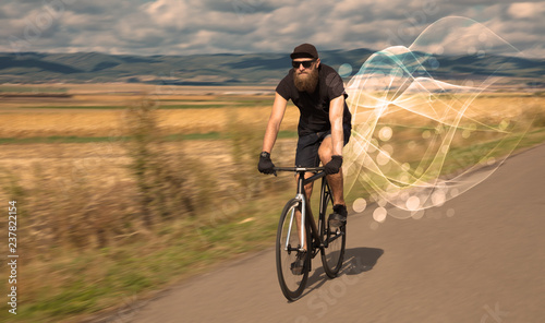 Gorgeous biker in the nature going somewhere with ethereal concept