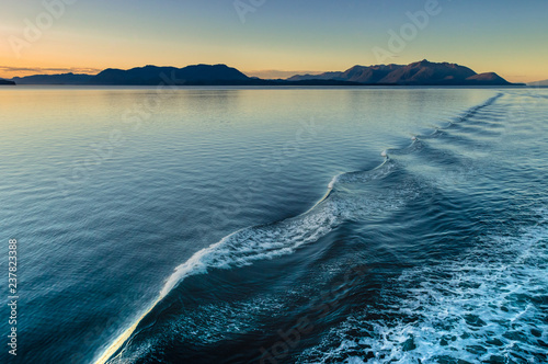 Beautiful morning light and water ripples from ship's wake, Alaska, USA.