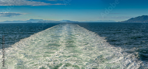 Sunny panorama of turbulent ship's wake through Stephen's Passage, Alaska, USA