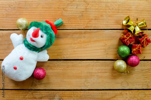 cute and lovely snowman doll on wooden table