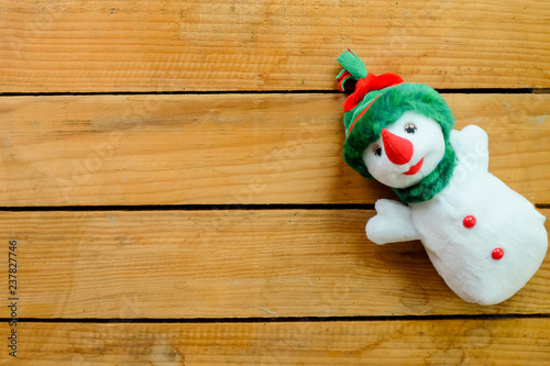 cute and lovely snowman doll on wooden table
