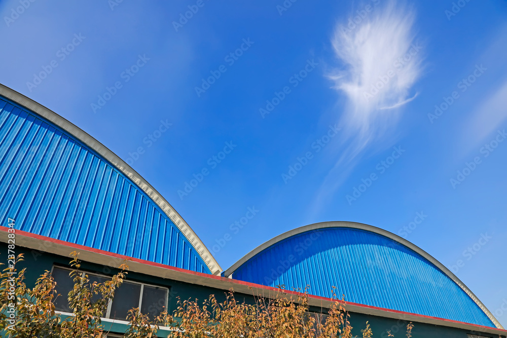 Arc factory building under the blue sky