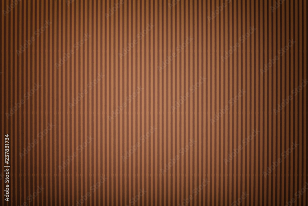 Obraz premium Texture of corrugated bronze paper with vignette, macro.