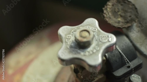 Valve of the gas bottle, countryside in Belarus photo