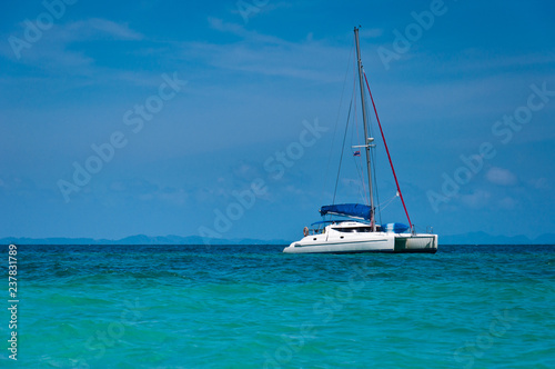 Small yacht in the sea with blue sky