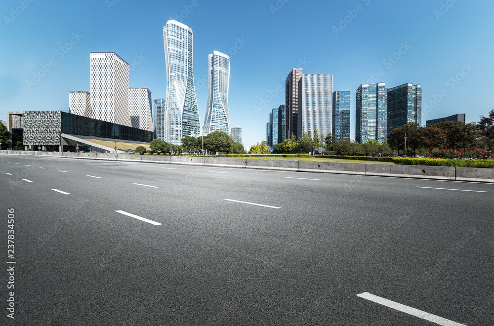 Empty road floor surface with modern city landmark buildings of hangzhou bund Skyline,zhejiang,china Empty road floor surface with modern city landmark buildings of hangzhou bund Skyline,zhejiang,china