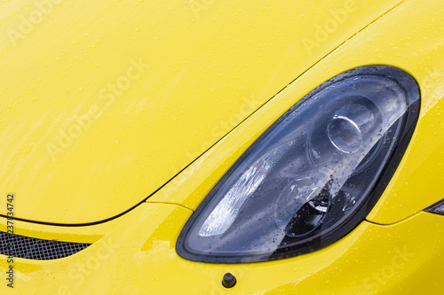 yellow shiny body of a german sportscar