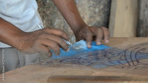 Wood carver in Lamu carving traditional swahili door photo