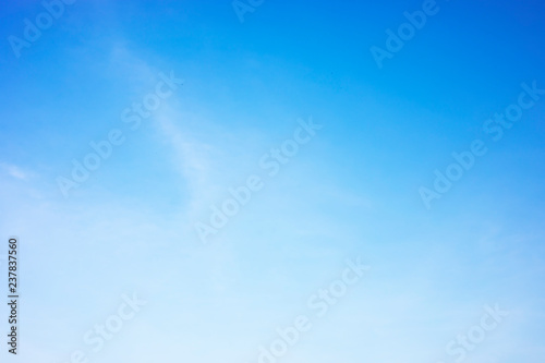 Fluffy blue sky background and white clouds soft focus, and copy space
