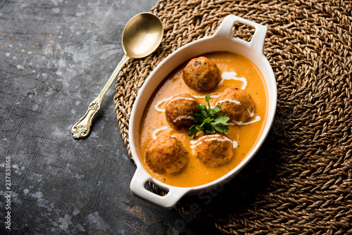 Malai Kofta Curry is a Mughlai special recipe served in a bowl. Selective focus photo