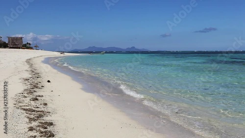 Wide, waves lap on Viwa Island beach photo