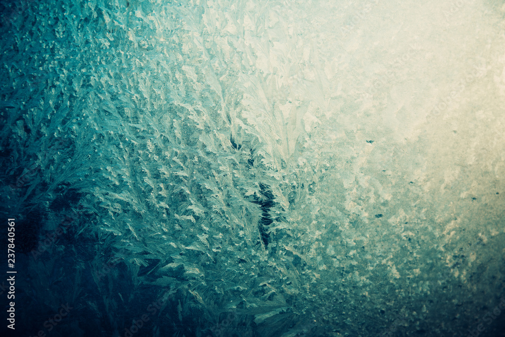 Frosty pattern on the glass, dark blue and yellow. Frosty pattern on the glass, dark blue and yellow.
