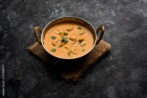 Cashew Curry / Indian kaju masala served in a bowl or pan. selective focus photo