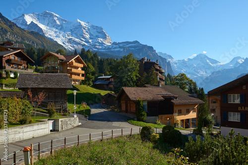 Jungfrau mountain view from the street of Wengen village in Switzerland.