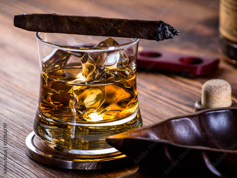 Whisky on the rocks and a cigar