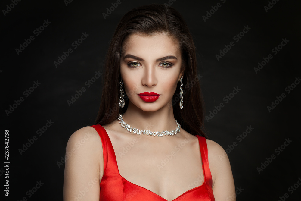 Gorgeous woman brunette with red lips makeup, diamond necklace and dark brown hair Gorgeous woman brunette with red lips makeup, diamond necklace and dark brown hair