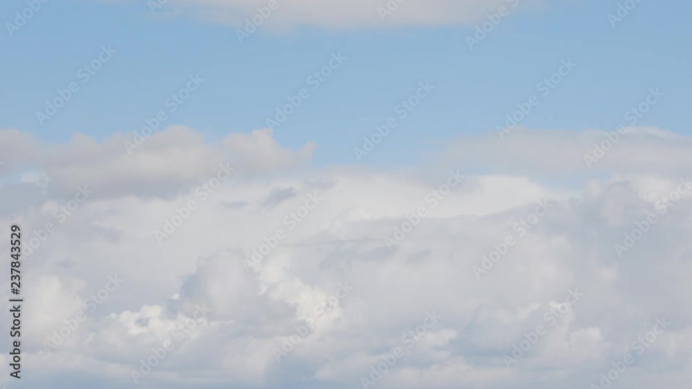 Blue sky background with white clouds. Long shot