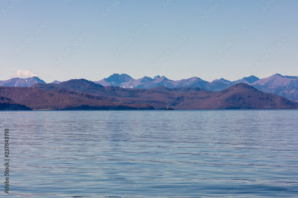 panoramic landscape with ocean and mountains