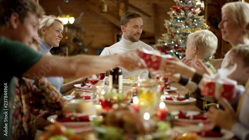 Happy family members exchanging presents on Xmas