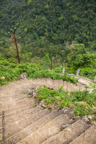 Staircase down the hill in a tropical forest. Way to Nongriat village with famous living root bridges in Meghalaya state, India photo