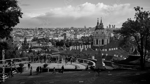 Aerial view of Prague from Prague Castle. Prague, Czech Republic. Tourists people looking over the beautiful city and relaxing. Black and white