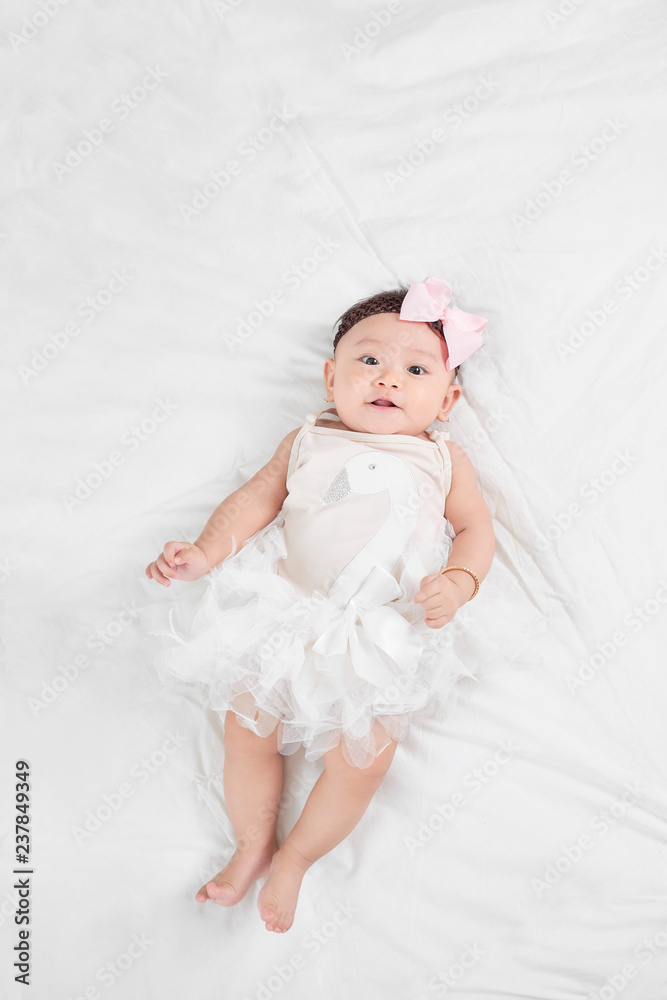 Asian baby girl laying on floor Asian baby girl laying on floor