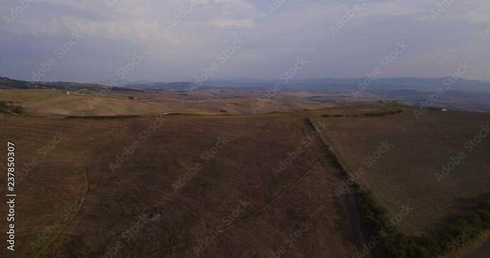 Aerial, gorgeous view on plowed fields landscape in Tuscany Aerial, gorgeous view on plowed fields landscape in Tuscany