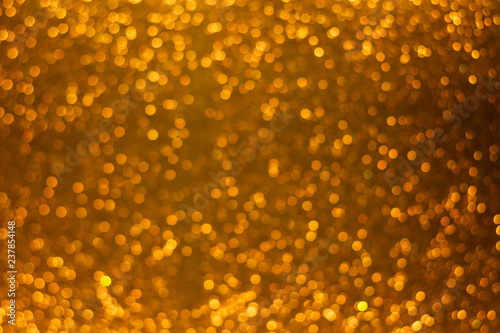Holiday shiny gold bokeh background  glitter  sparkles  defocused glow