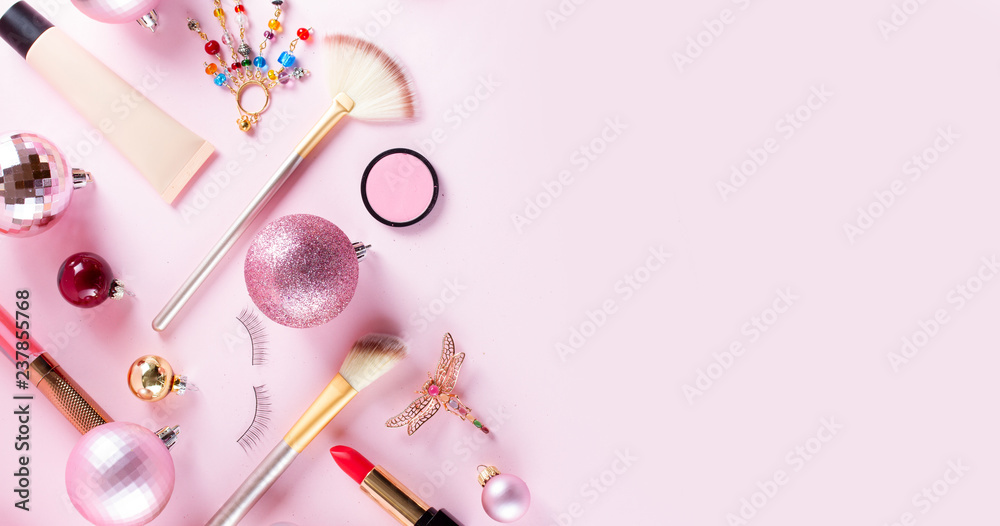 Festive make up products close up border banner on pink background Festive make up products close up border banner on pink background